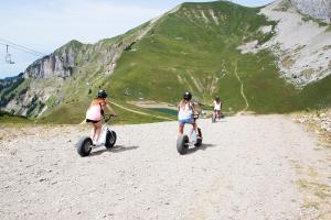 students doing dirt scooter