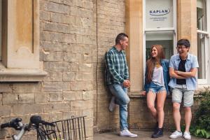 students talking outside the school