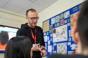 teacher explaining something in a classroom