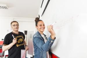 student writing on the board