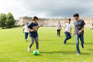 students playing soccer in bath