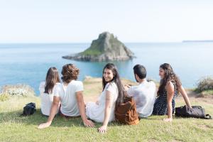students in torquay looking at the sea