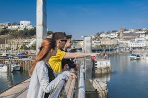 students looking at the pier