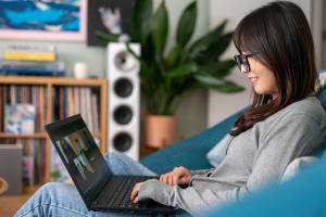 student working on her laptop