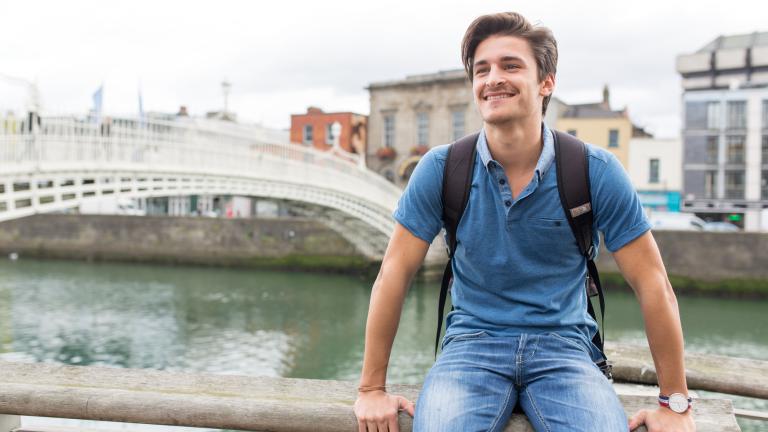 kaplan-dublin-male-student-in-front-of-bridge.jpg