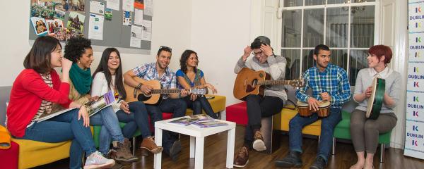 studends playing instruments inside the school