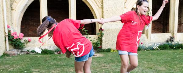 two students dancing inside the brighton campus