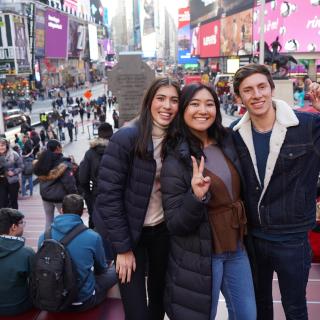 students on times square doing a picture