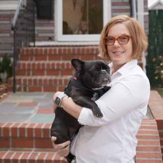 woman holding a dog