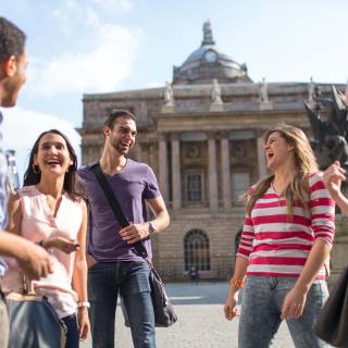 students laughing together in Liverpool