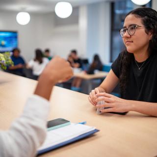 student chatting with somebody in the school