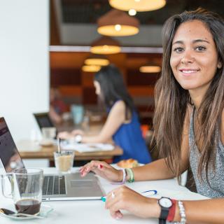 student working in a coffee shop