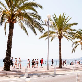 students walking near the beach