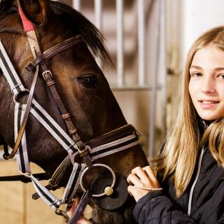 student with a horse