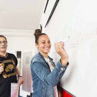 student writing on the board