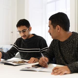 two students working together in classroom