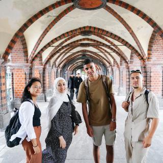 students in front of university