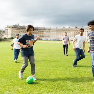 students playing soccer in bath