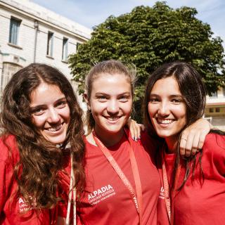 3 students smiling at the camera