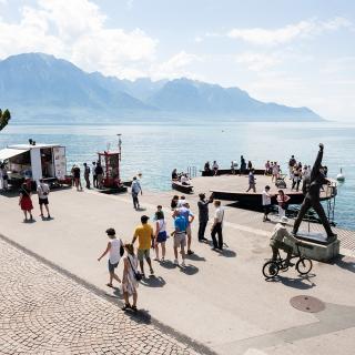 people walking near Geneva Lake in Montreux