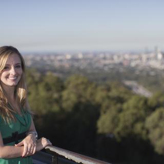 student in front of brisbane